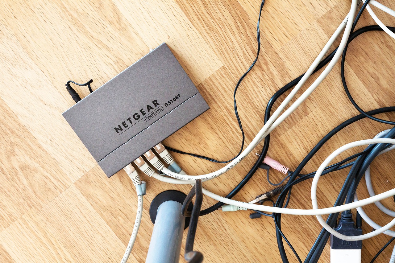 image: router with leads on a wooden floor